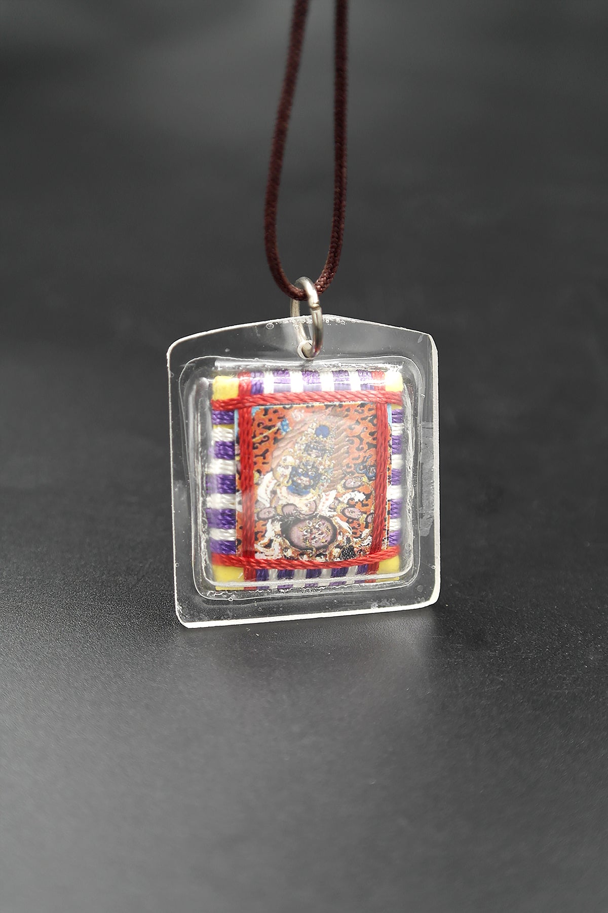 Honor the fierce compassion of Mahakala with Tibetan Sungkhor amulet pendant