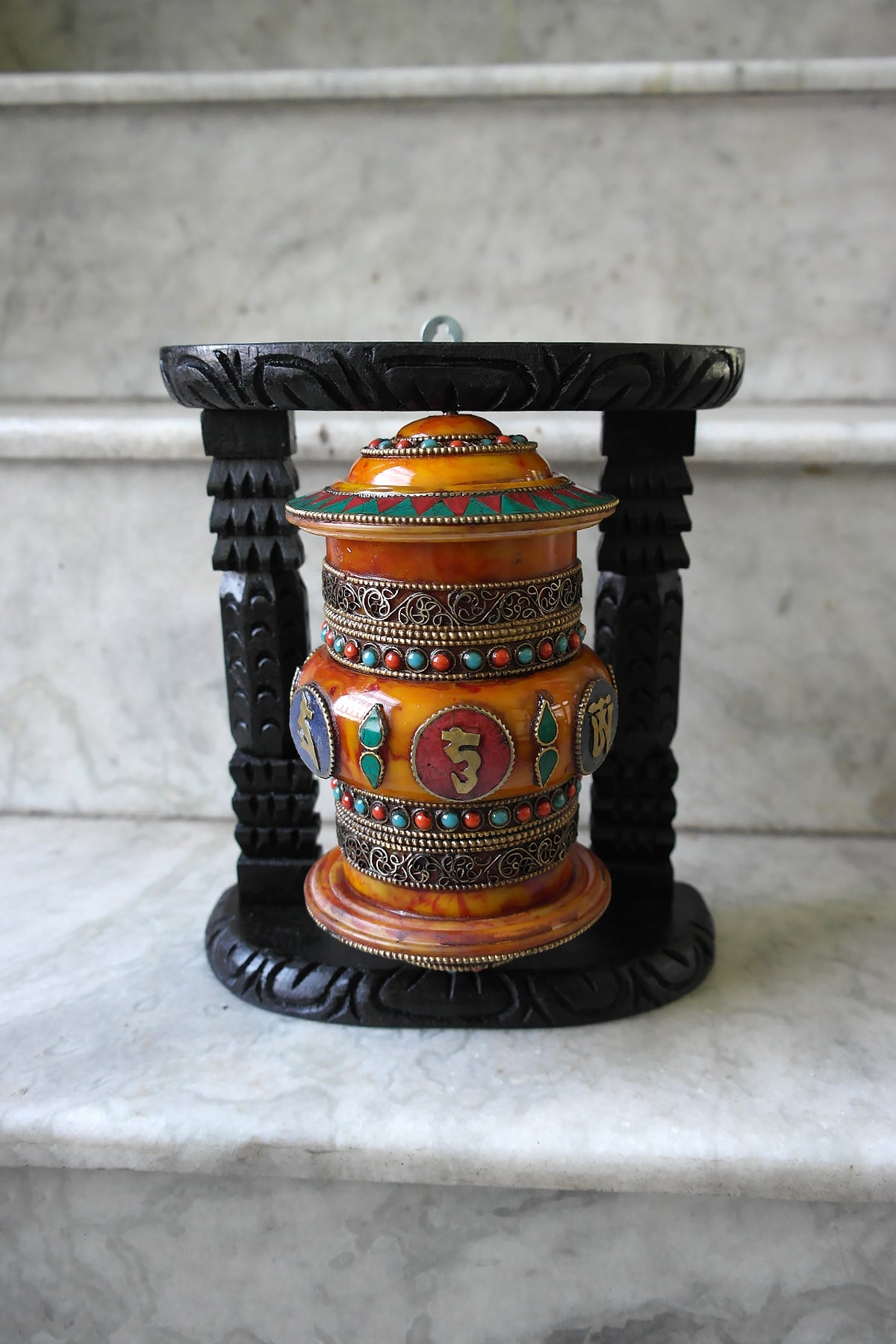 Om Mane peme hum on Gemstone in Prayer Wheel with black frame