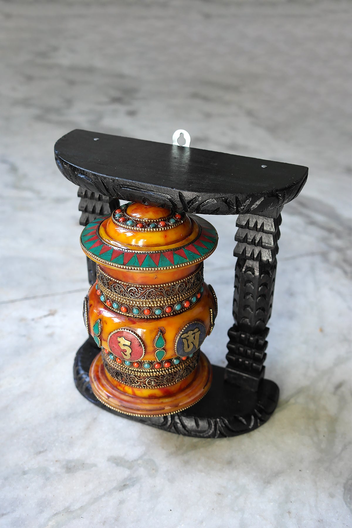 Om Mane peme hum on Gemstone in Prayer Wheel with black frame