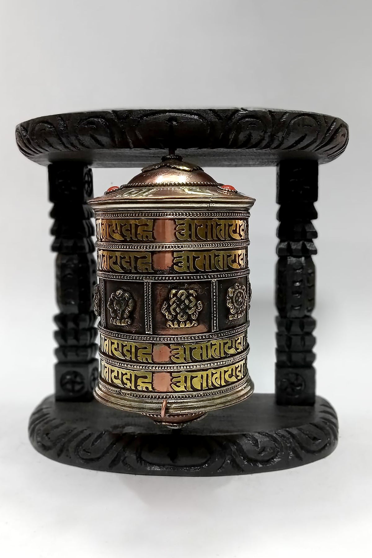 Tibetan mantra Om Mane peme hum and eight Auspicious symbols embossed Prayer Wheel