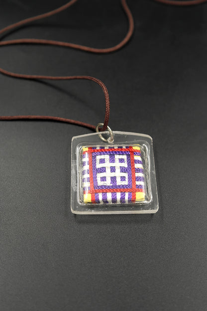 Honor the fierce compassion of Mahakala with Tibetan Sungkhor amulet pendant
