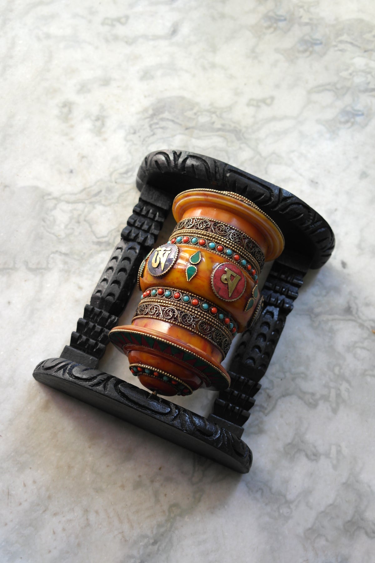 Om Mane peme hum on Gemstone in Prayer Wheel with black frame