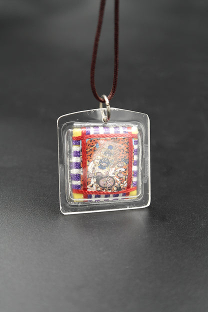 Honor the fierce compassion of Mahakala with Tibetan Sungkhor amulet pendant