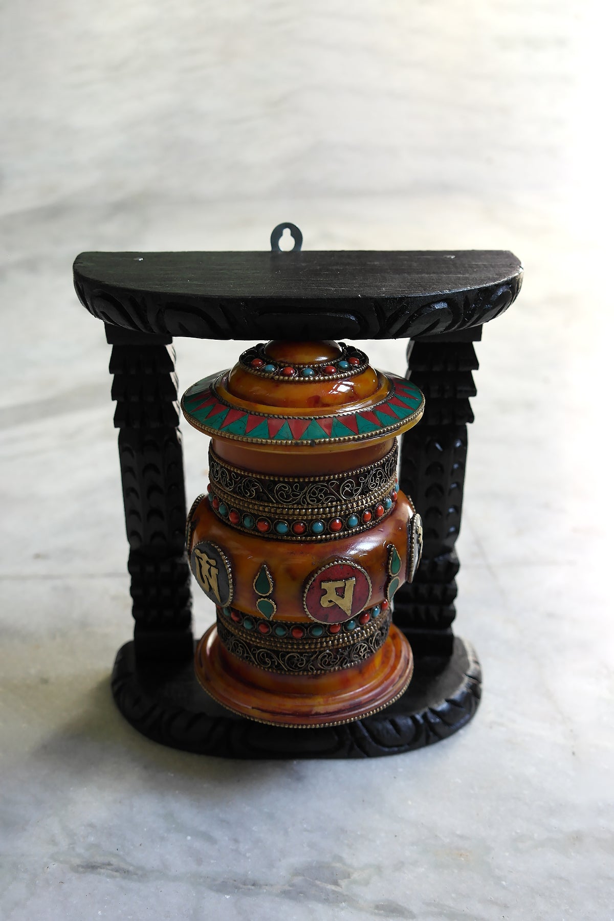 Om Mane peme hum on Gemstone in Prayer Wheel with black frame