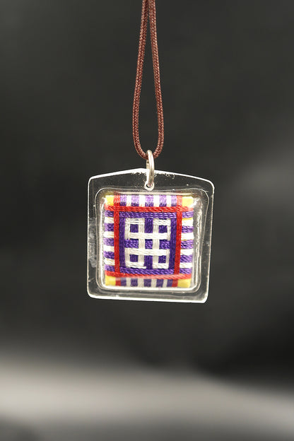 Honor the fierce compassion of Mahakala with Tibetan Sungkhor amulet pendant