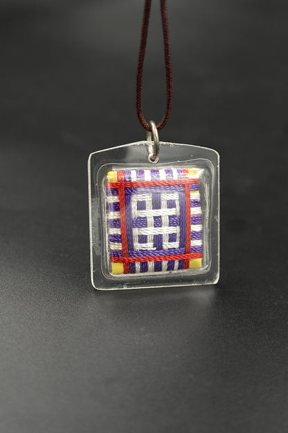 Honor the fierce compassion of Mahakala with Tibetan Sungkhor amulet pendant