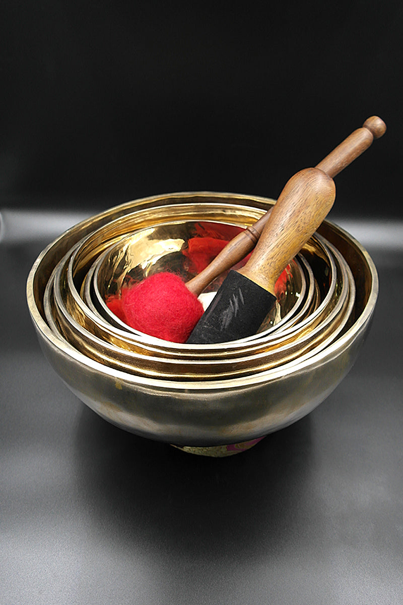 Set of seven Chakra singing bowls with ring cushion, mallet and drumstick 7"-11"